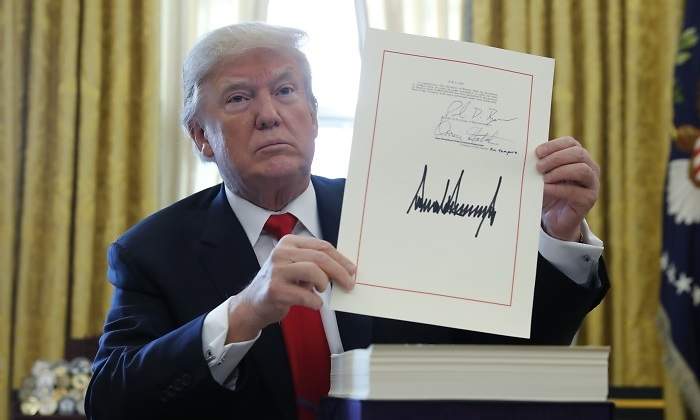 trump-firma-reforma-fiscal-reuters.jpg