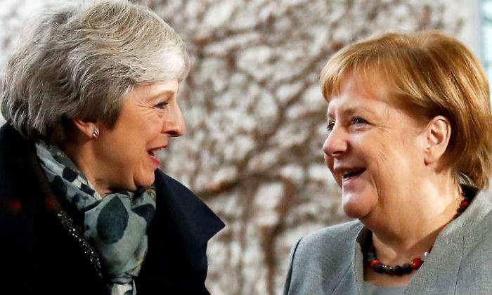 may-merkel-juntas-reuters.jpg