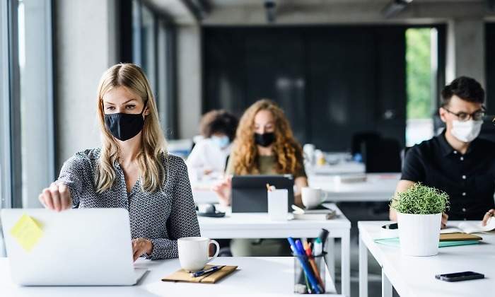 young-people-with-face-masks-back-at-work-or-school-in-office-after-picture-id1250279730.jpg