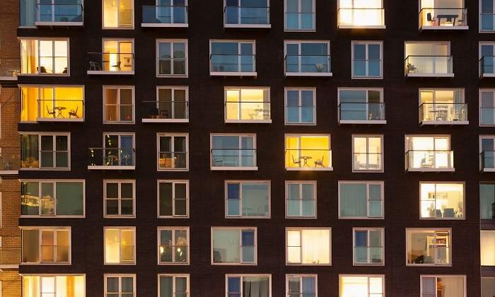 modern-apartment-block-at-dusk-picture-id1138249927.jpg