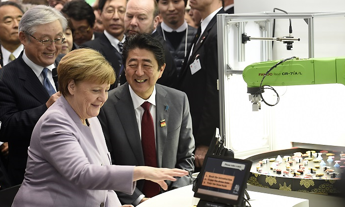 hitachi-merkel-abe-feria-reuters-770x420.png